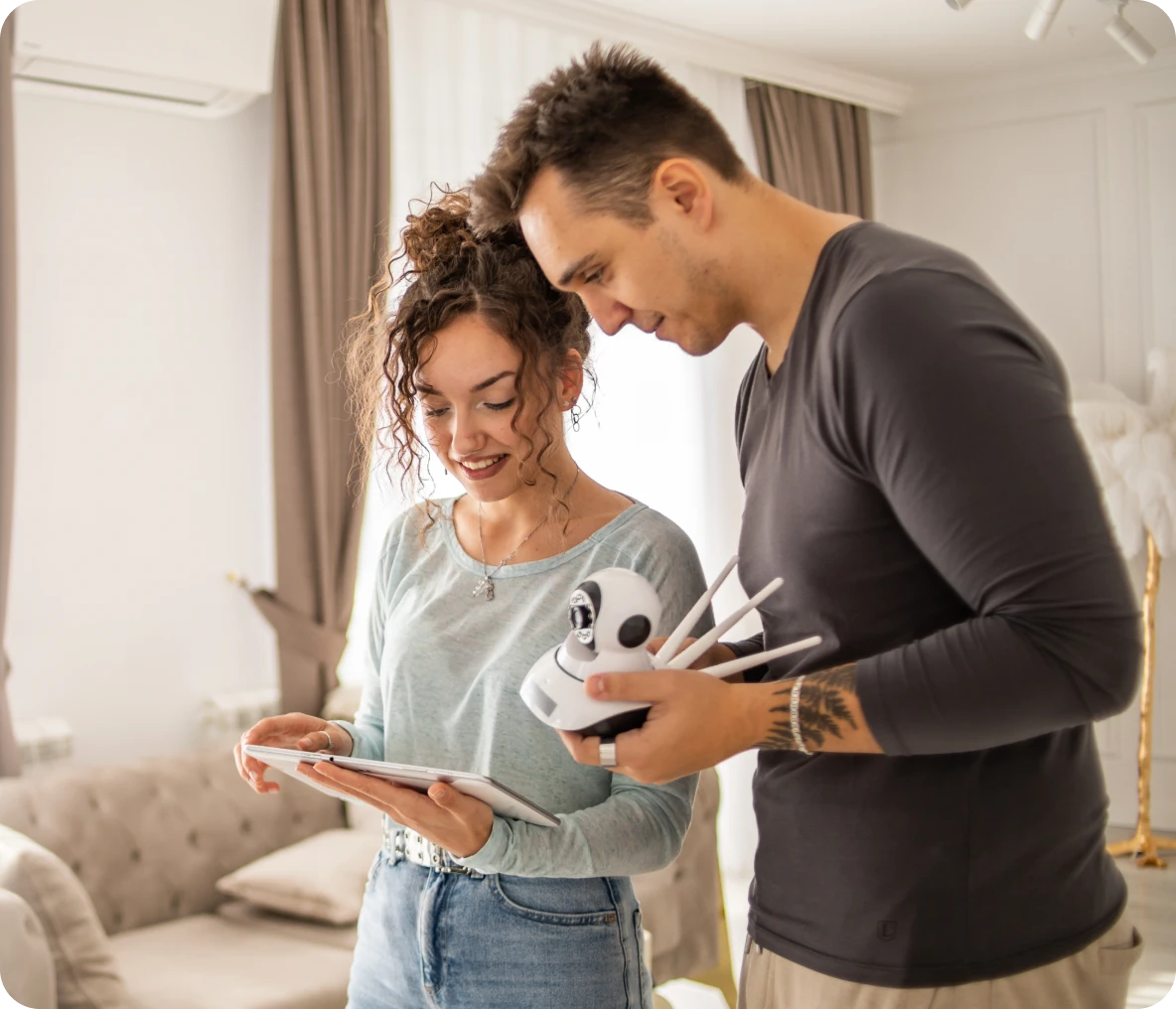 Couple setting up a smart home camera